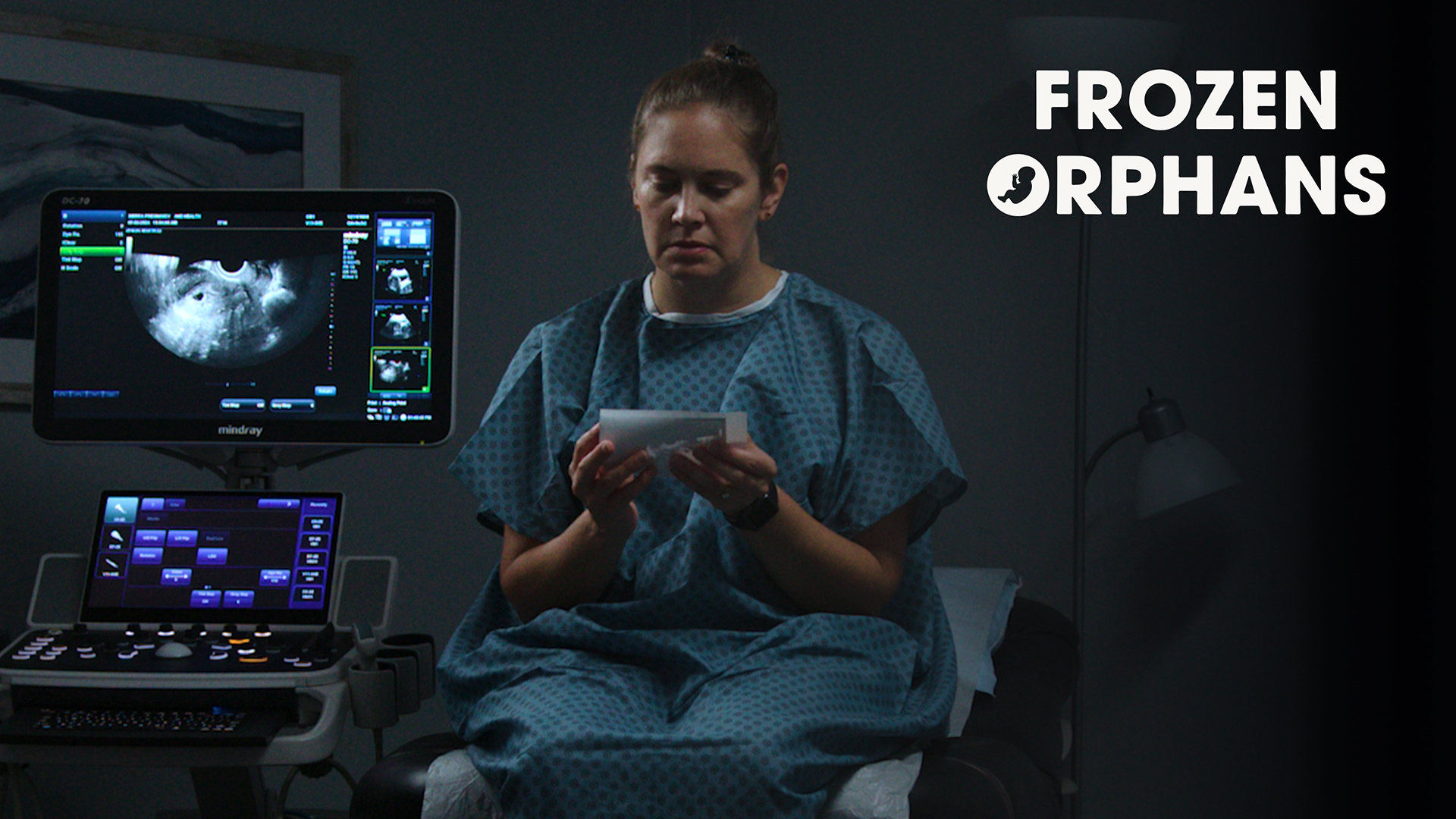 Kirsten Upadhye next to an ultrasound machine in a fertility clinic