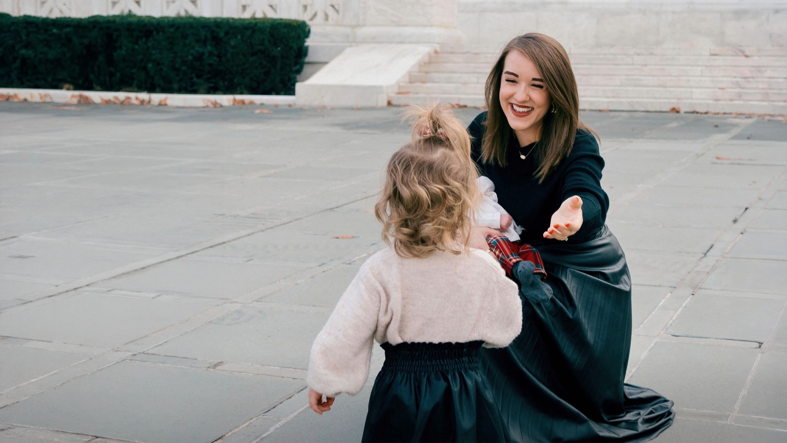 Mom, Emma Waters reaching out to a child